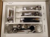 6. Cutlery with stuff to make coffee, tea or other drinks.